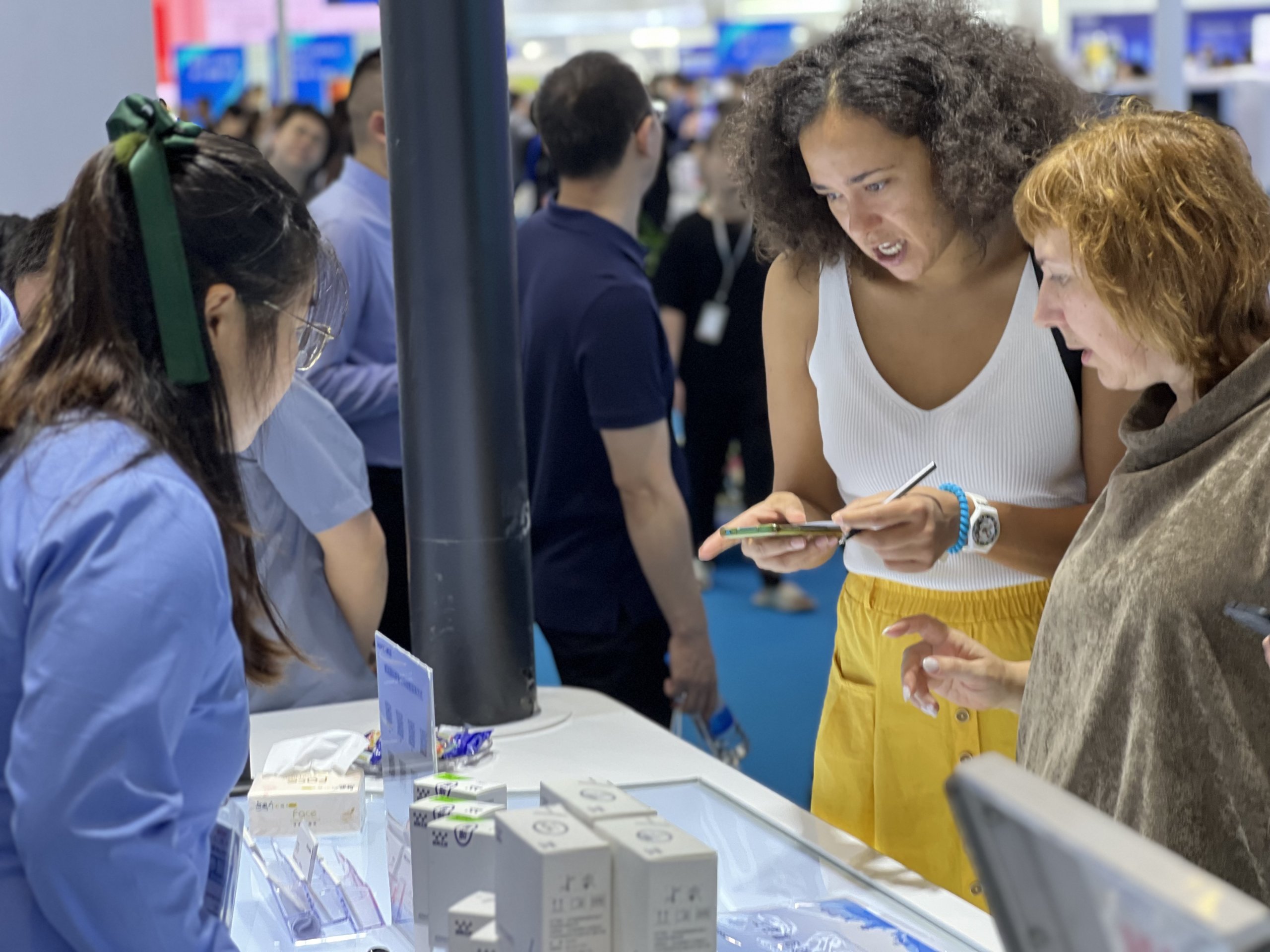 WEGO Medical employees talk to customers at the CMEF exhibition